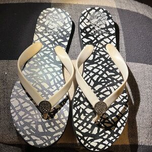 Flip flops black and white used but still good condition
